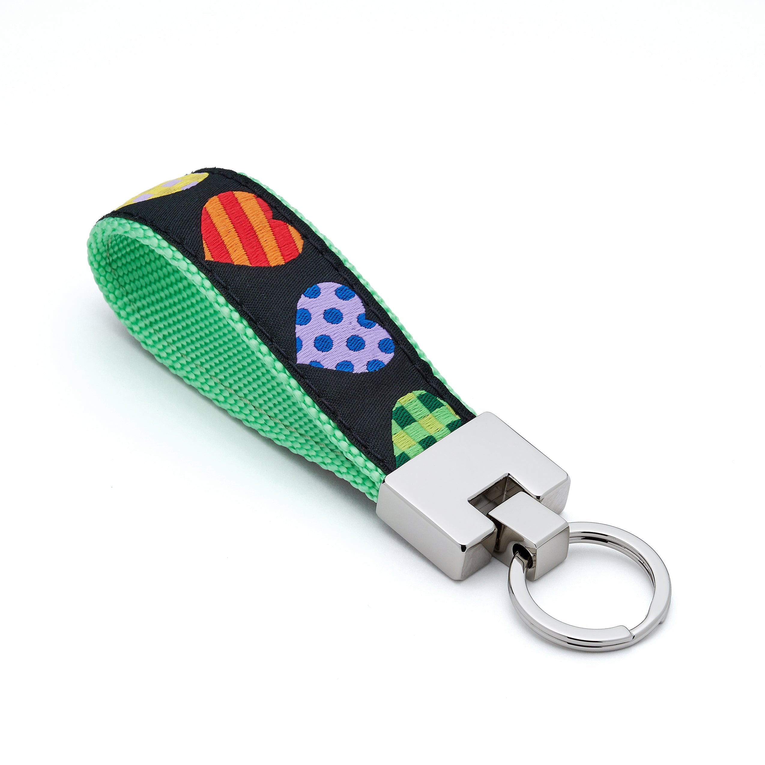 Keychain with colorful heart pattern on a green strap against a white background