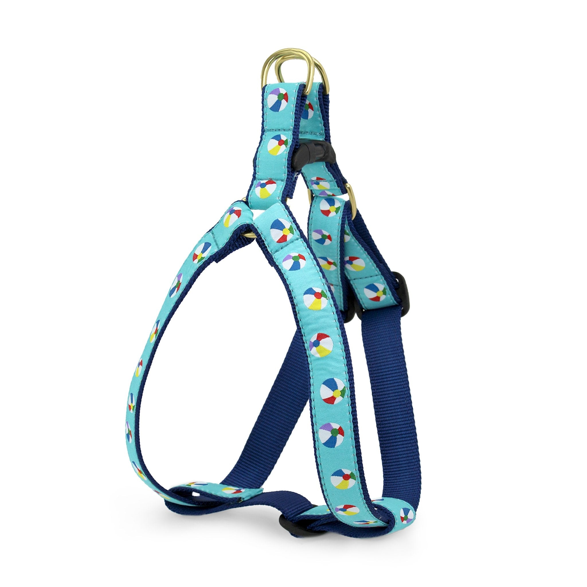 Dog harness with colorful beach ball pattern on a blue background