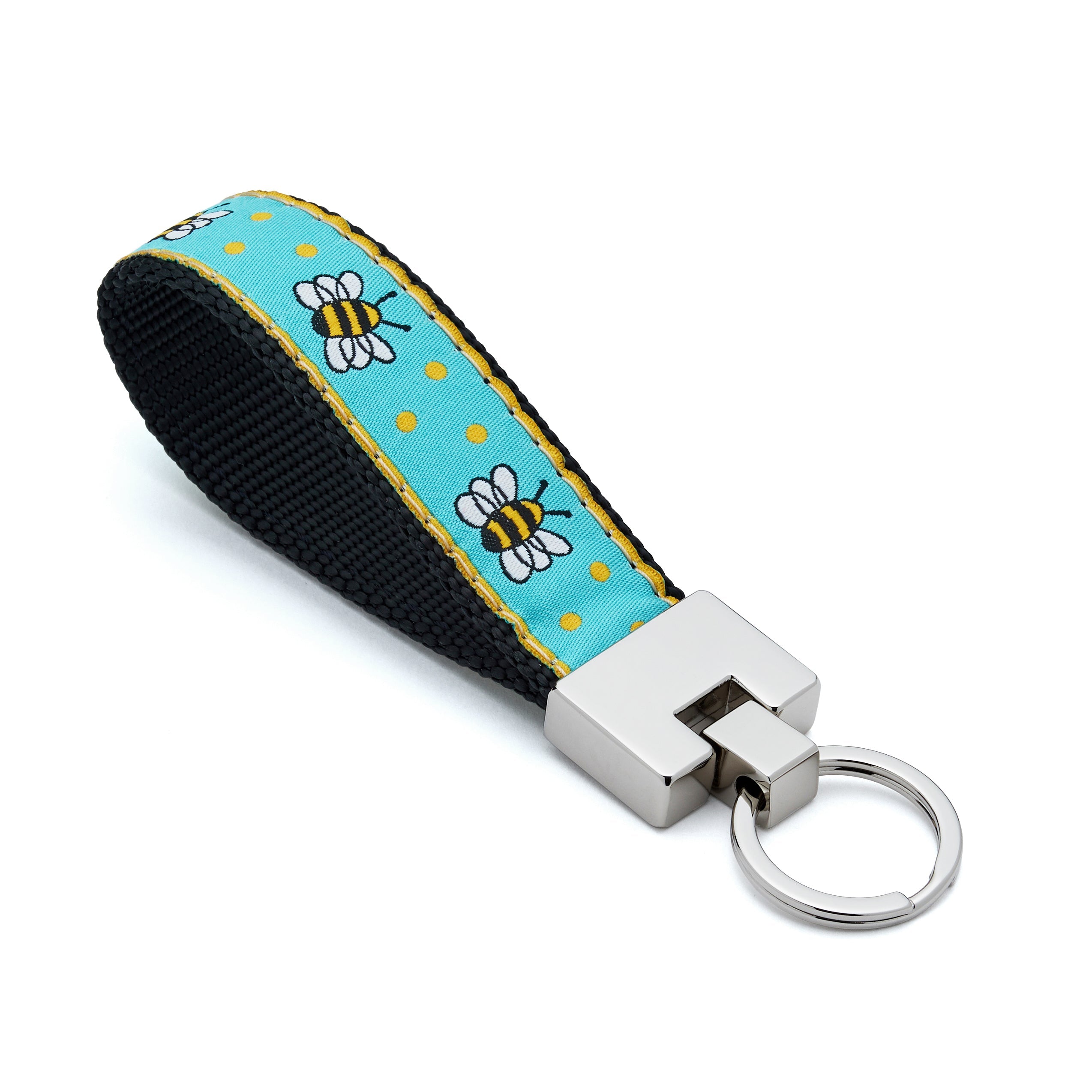 Keychain with bee and flower pattern on a blue background