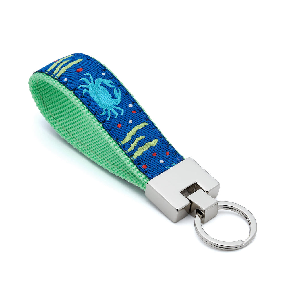 Keychain with crab design on a blue and green strap