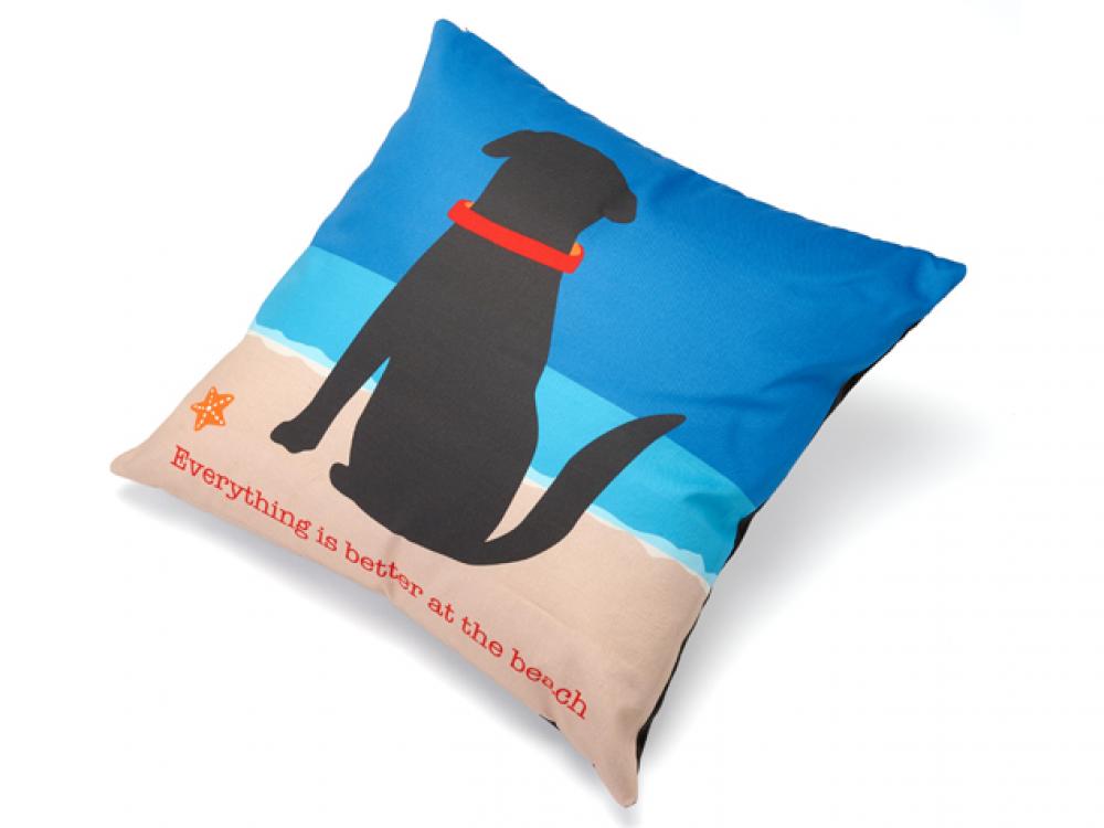 Pillow with a dog illustration and beach-themed text on a blue and beige background Everything is better at the beach
