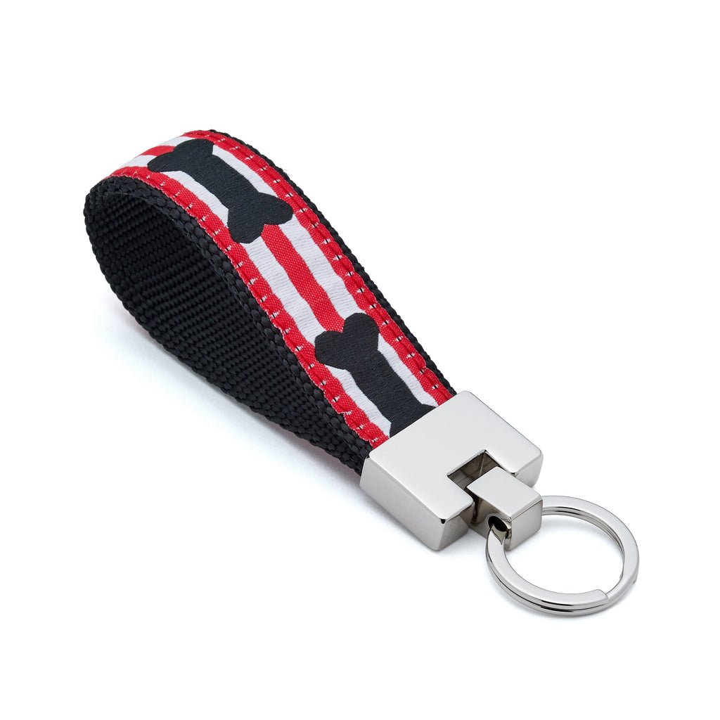 Keychain with red, white, and black pattern on a white background bone 