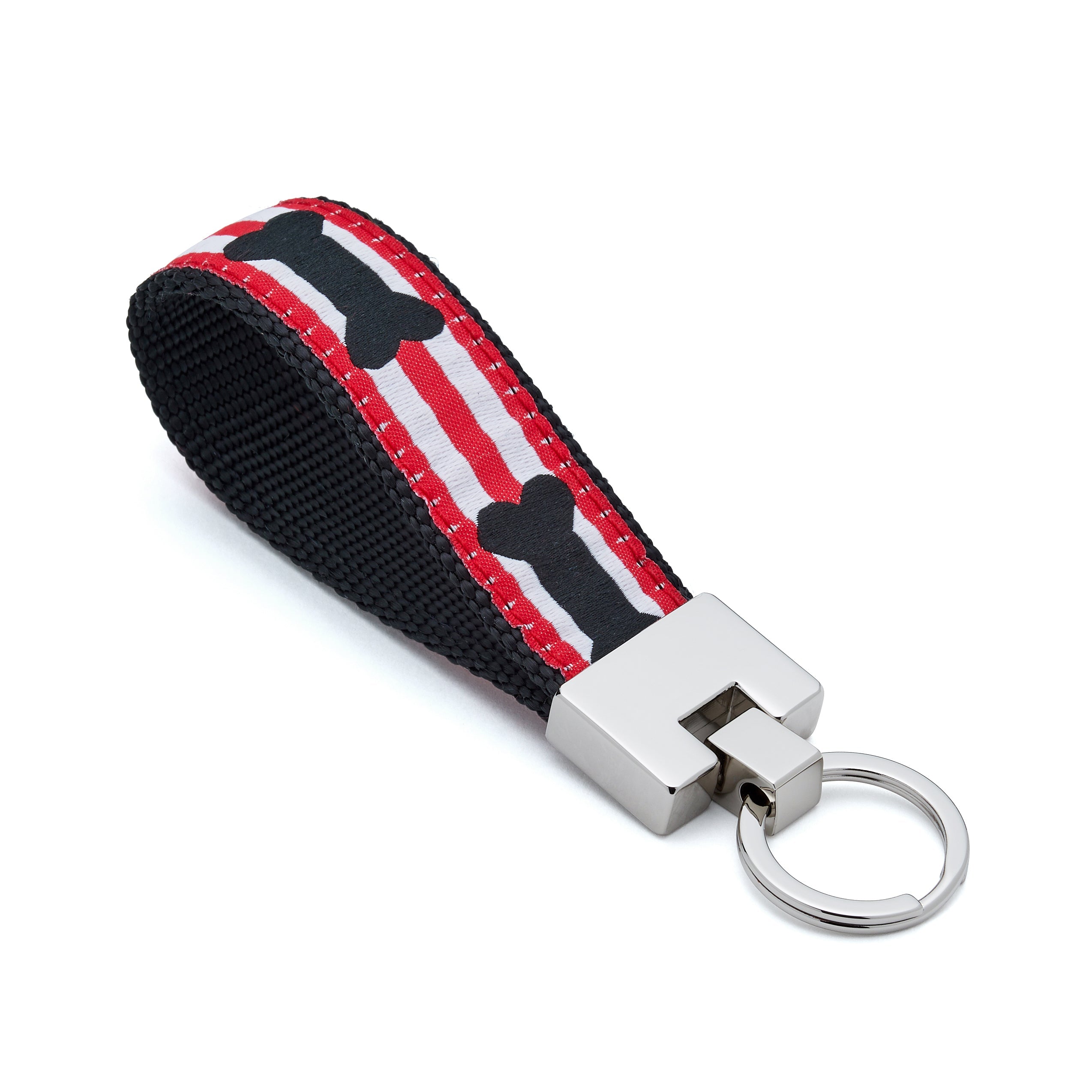 Keychain with red, white, and black pattern on a white background bone 