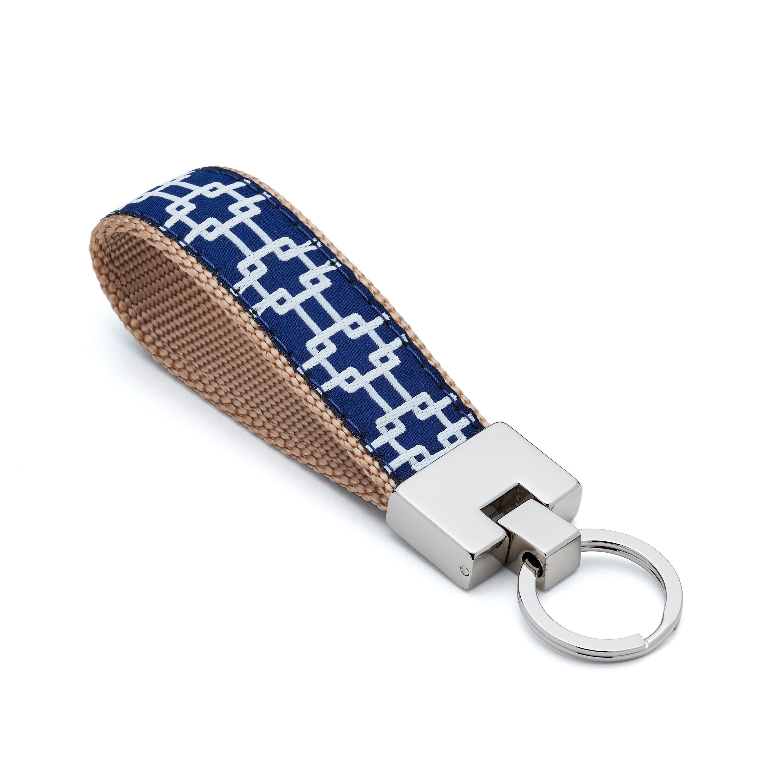 Keychain with blue and beige patterned strap on a white background