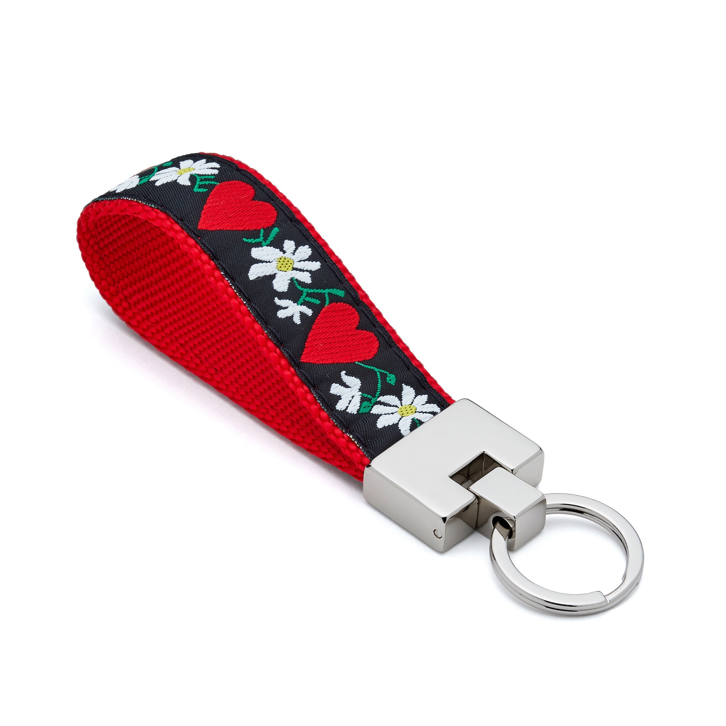 Keychain with red hearts and white flowers on a black background
