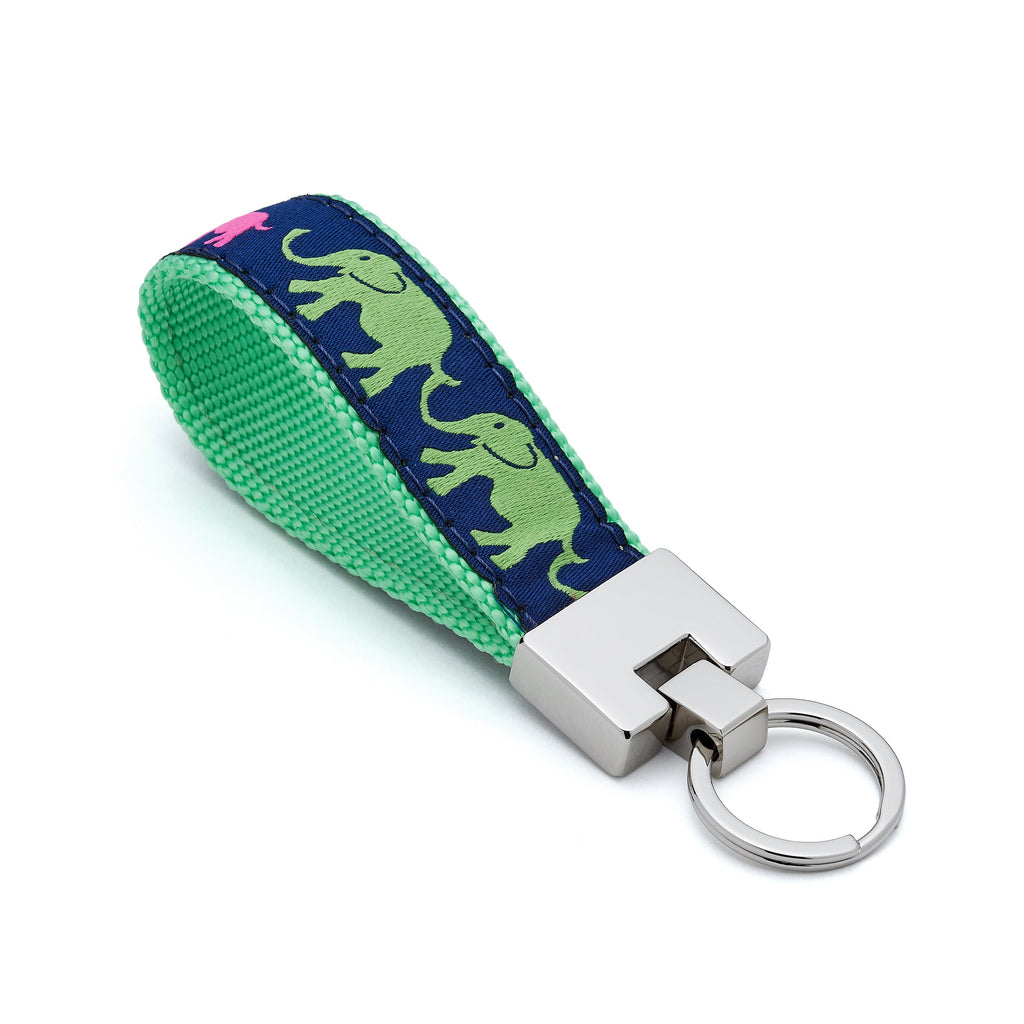 Keychain with green fabric strap featuring elephant design 