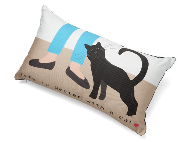 Pillow with a cat design and text 'Life is better with a cat' on a beige background