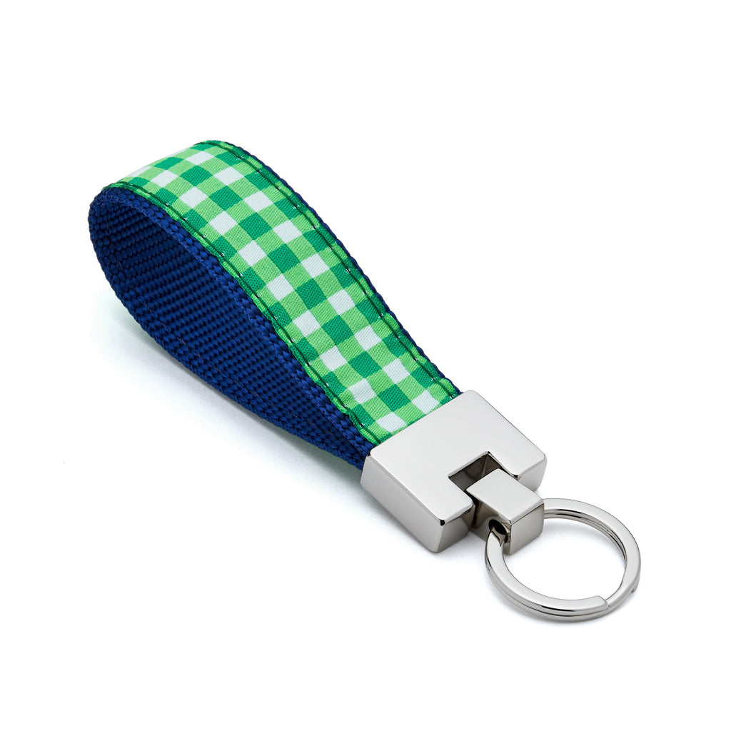 Keychain with green and blue checkered strap on a white background