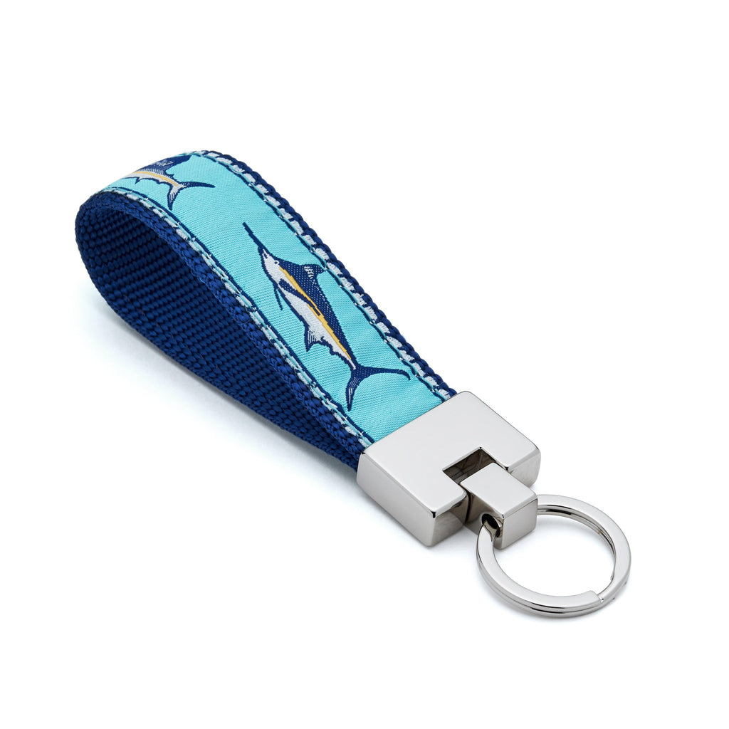 Keychain with blue and white fish pattern on a light blue background fishing 