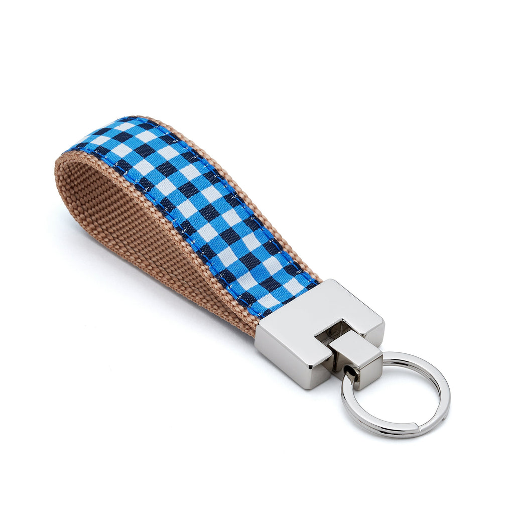 Keychain with blue and white checkered strap on a white background
