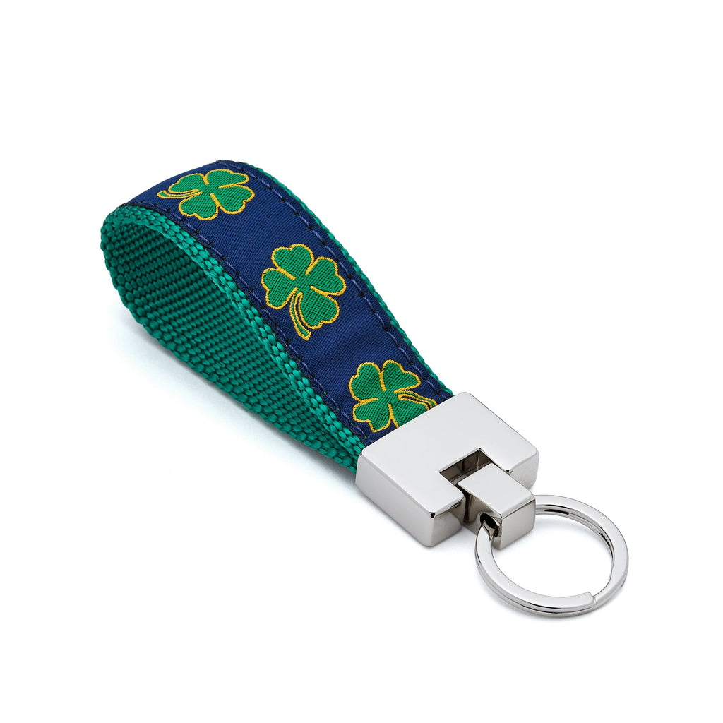 Keychain with green clover pattern on a blue background lucky leprechauan