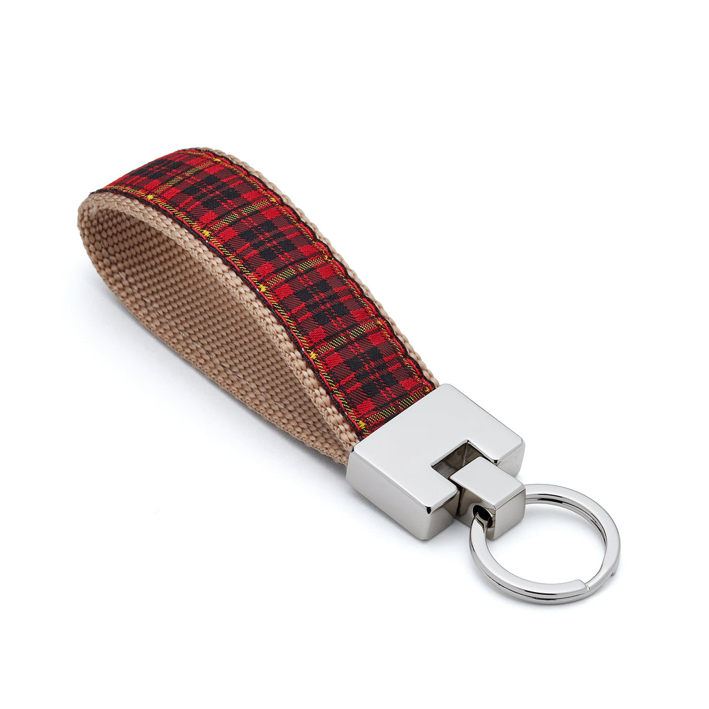 Keychain with red plaid fabric strap on a white background