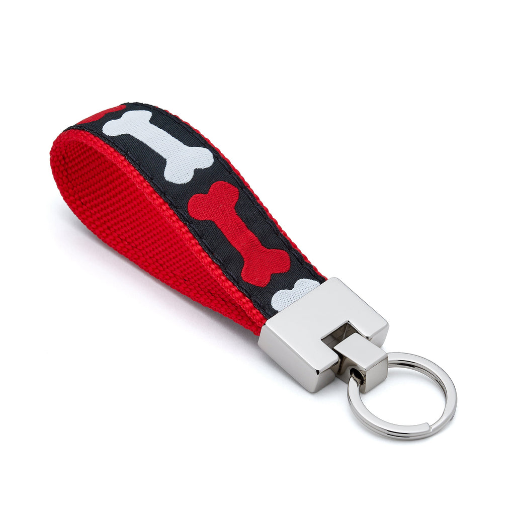 Keychain with red and black bone pattern on a white background