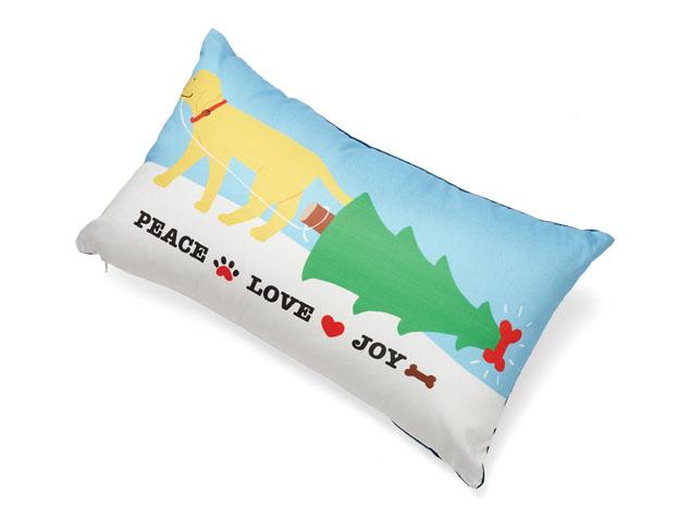 Decorative pillow with a dog, Christmas tree, and text on a blue background