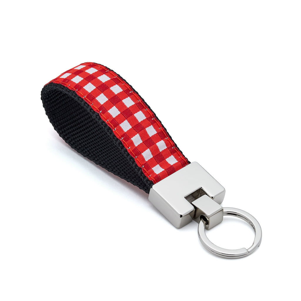 Keychain with red and black checkered strap on a white background