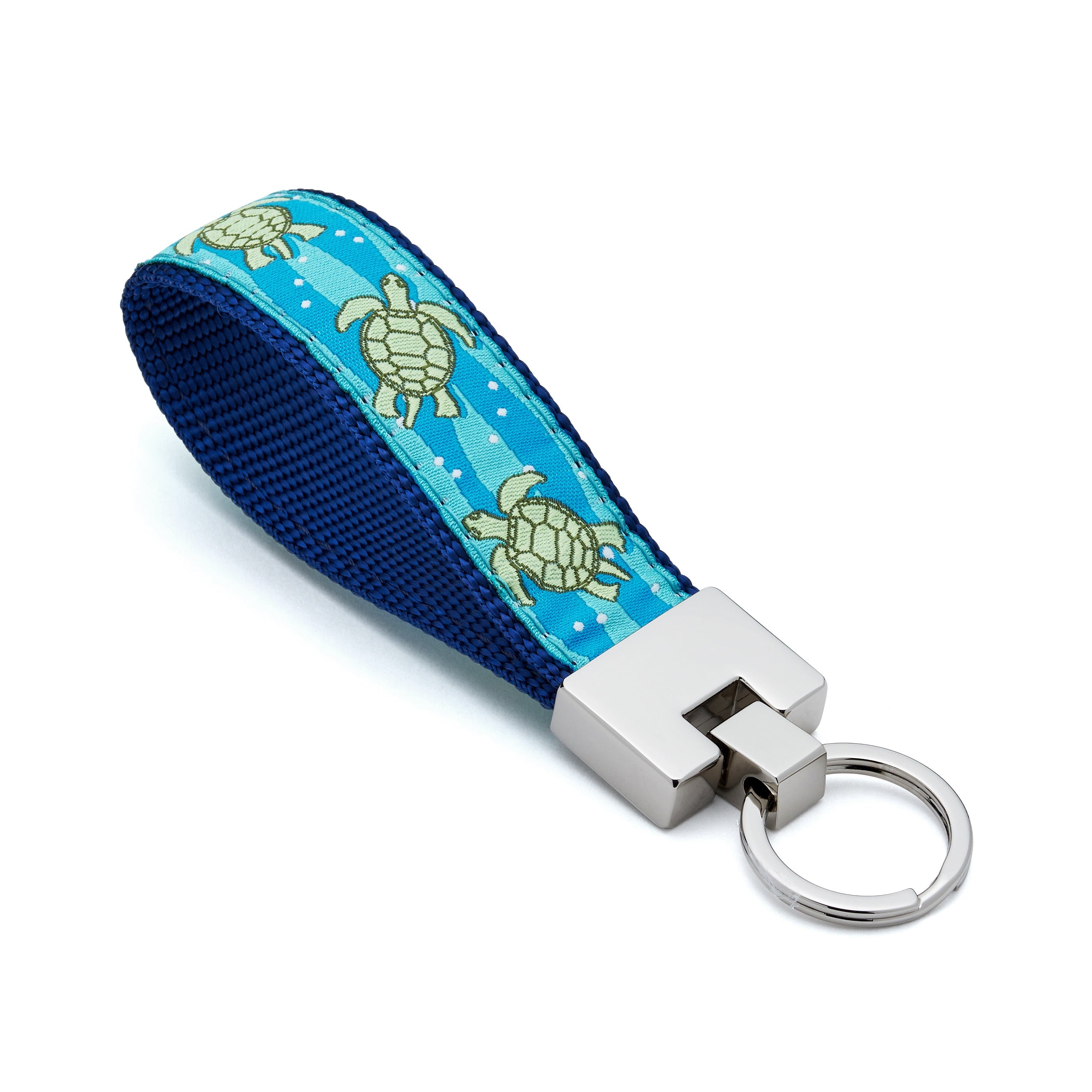 Keychain with blue strap featuring  sea turtle design on a white background