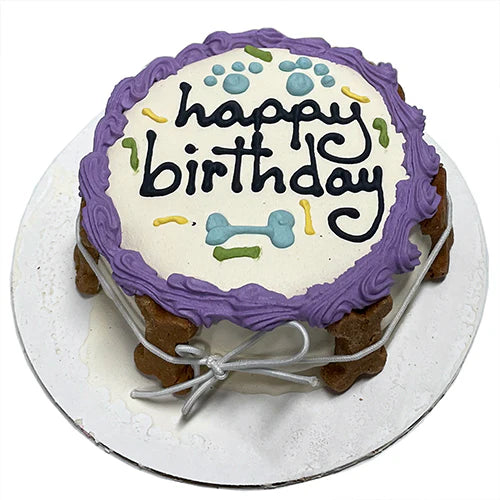 Dog birthday cake with 'happy birthday' text on a white background